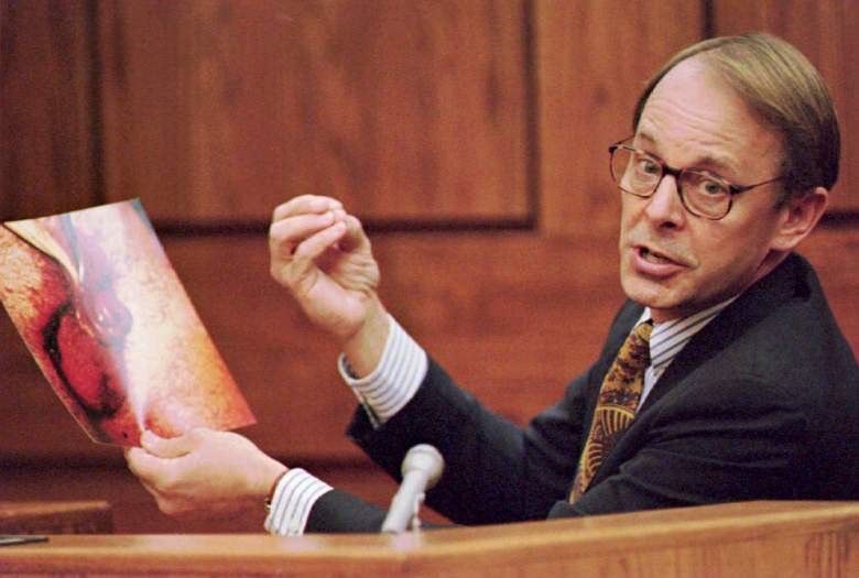 Dr. James T. Sehn holds a photo of the severed pen
