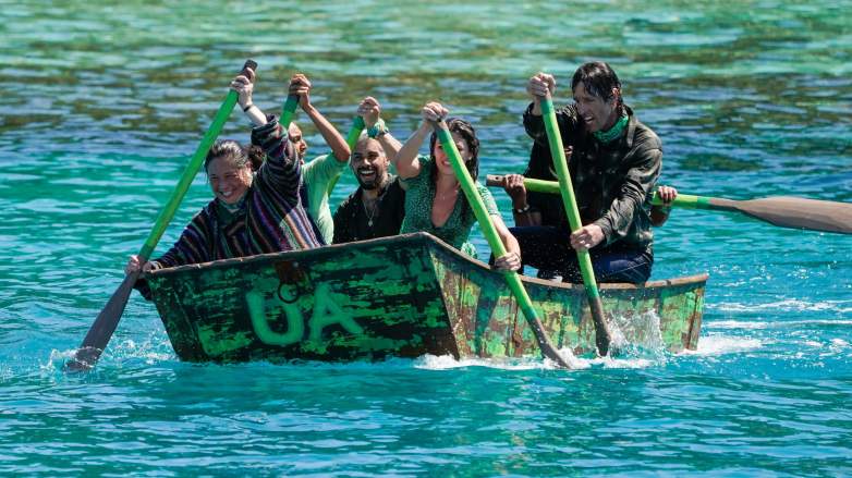 The Ua tribe paddles to shore